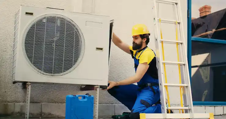 worker works air conditioner